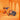 Colorful chocolate gift boxes and assorted chocolates are displayed on an orange background with arched cutouts, creating a vibrant and festive scene.