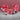 Venchi Mothers Day gift boxes and chocolates. A pink round box, square box, and small handbag-shaped box are decorated with red floral patterns and hearts.