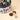 Venchi Medium Vintage Dream Tin Hamper, featuring an assortment of pralines with a single and halved chocolate truffle. - AI generated text