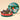 Vintage Dream Hamper Medium: a round gift box adorned with a festive green ribbon, revealing an array of fine chocolates. - AI generated text